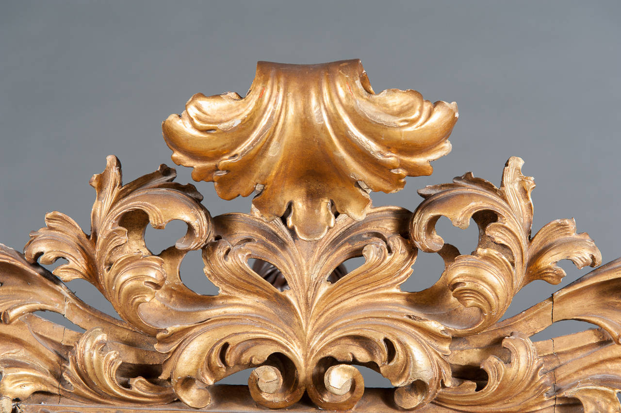 An Intricate 19th Century French Giltwood Rococo Style Vanity or Wall Mirror In Excellent Condition In Los Angeles, CA