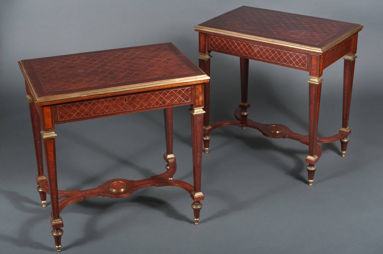 A Pair of 19th Century English Mahogany Side Tables with Gilt Brass Mounts & a Stretcher

Circa 1870

Origin: United Kingdom

Height: 30.5"
Width: 29.5"
Depth: 19.5"

Maker: Unknown

Excellent Condition

Material: Mahogany and