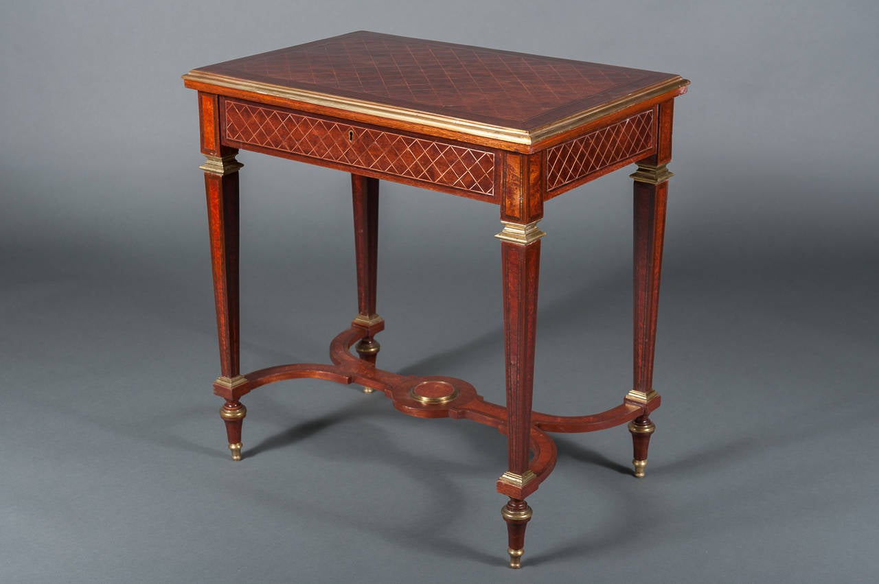 A Pair of English Mahogany Side Tables with Gilt Brass Mounts & a Stretcher 1