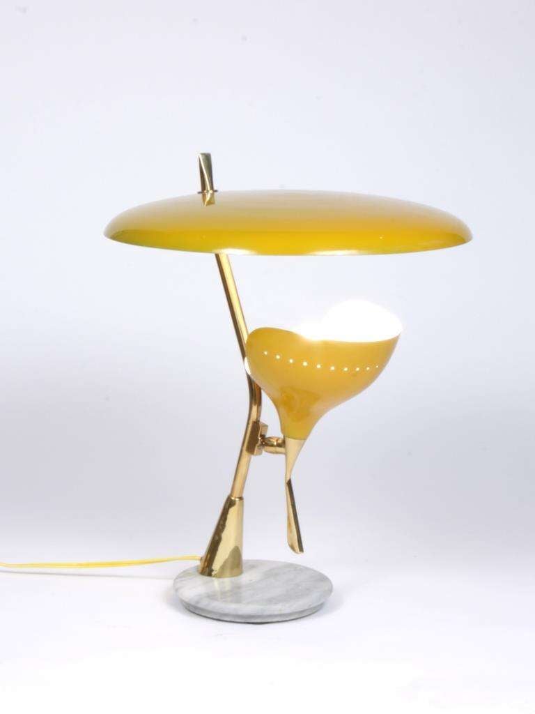 Yellow light attributed to Angelo Lelli and edited by Arredoluce in Italy circa 1955.
Brass, yellow lacquered metal, marble.