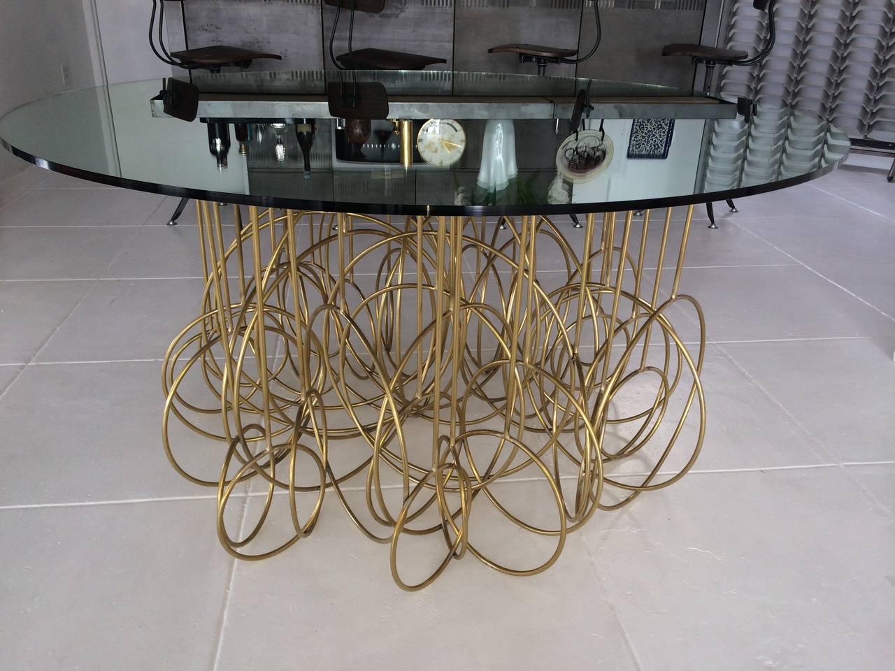 A fabulously extravagant French brass dining table. Top is a 1/2
