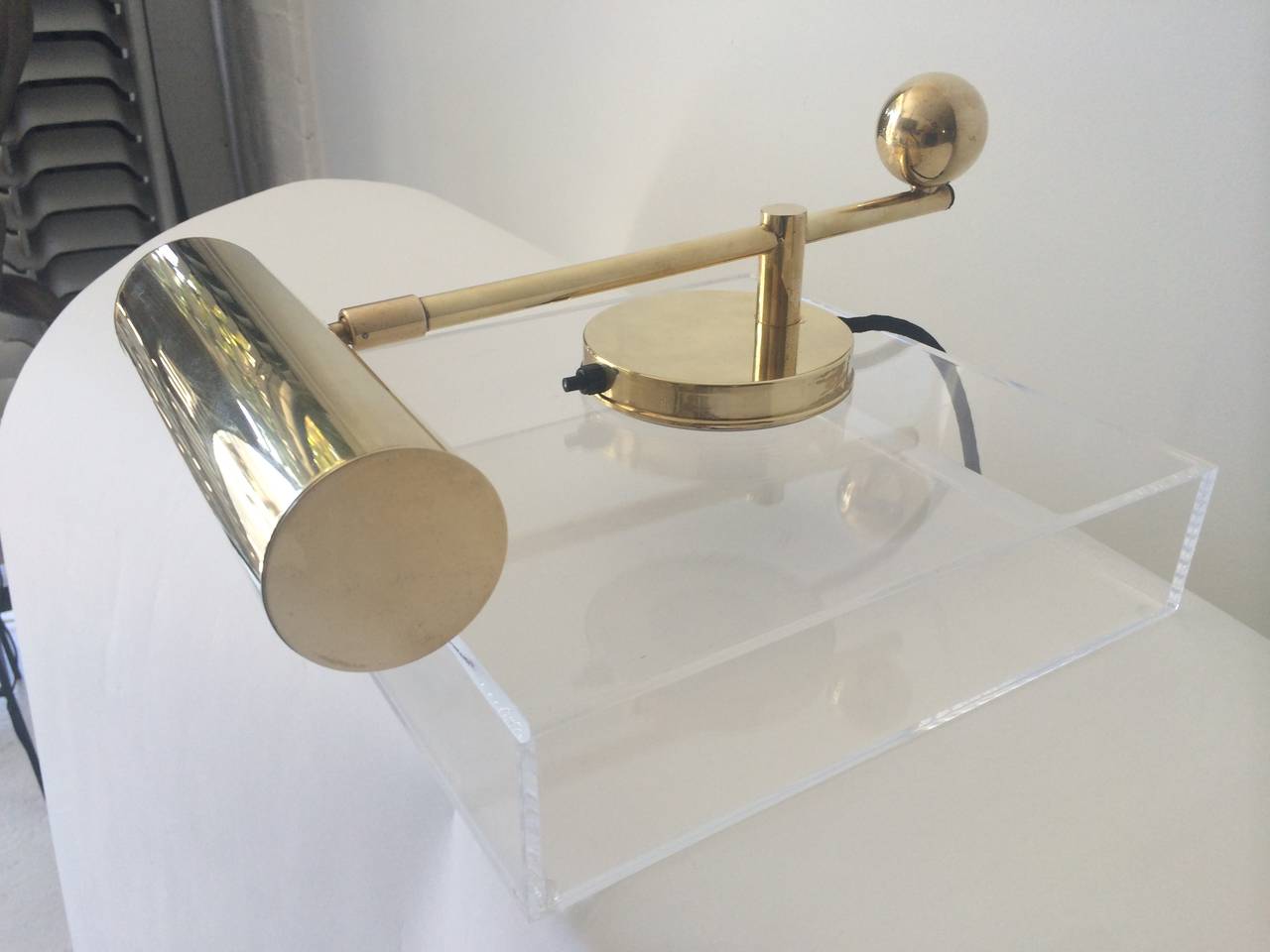 Wonderful and unique lamp manufactured by
W. H. Gispen in Netherlands, 1928.  Plated brass and plated nickel. The acrylic base is 11.5 inches square x 2.75 inches high.