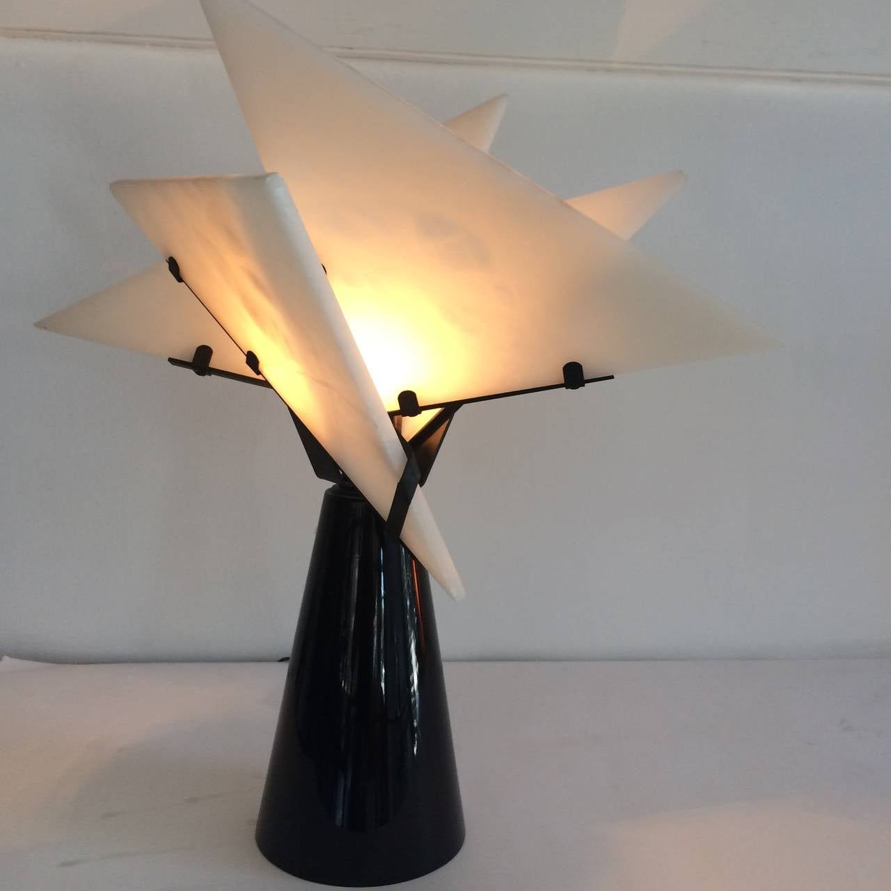 Beautiful Pierre Chareau Table Lamp, 1980s Edition.  Black-lacquered base and alabaster shades.