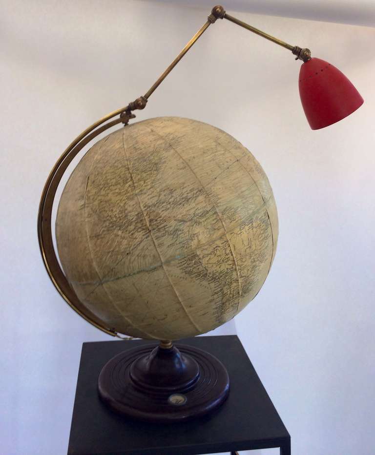 Very unique, one of a kind Italian Globe with articulated lamp.  Brass with red metal adjustable lamp shade. 

18