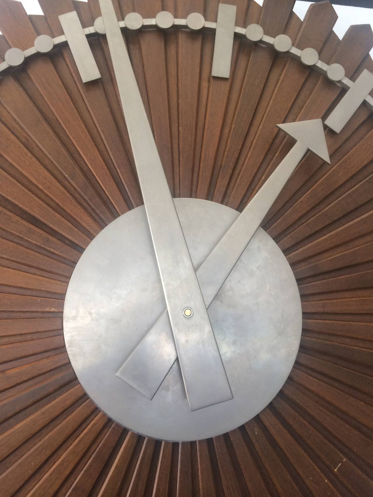Extraordinary 1940s wall clock, beautiful combination of wood and aluminum.  Clock is electric. Provenance bank in Chicago.