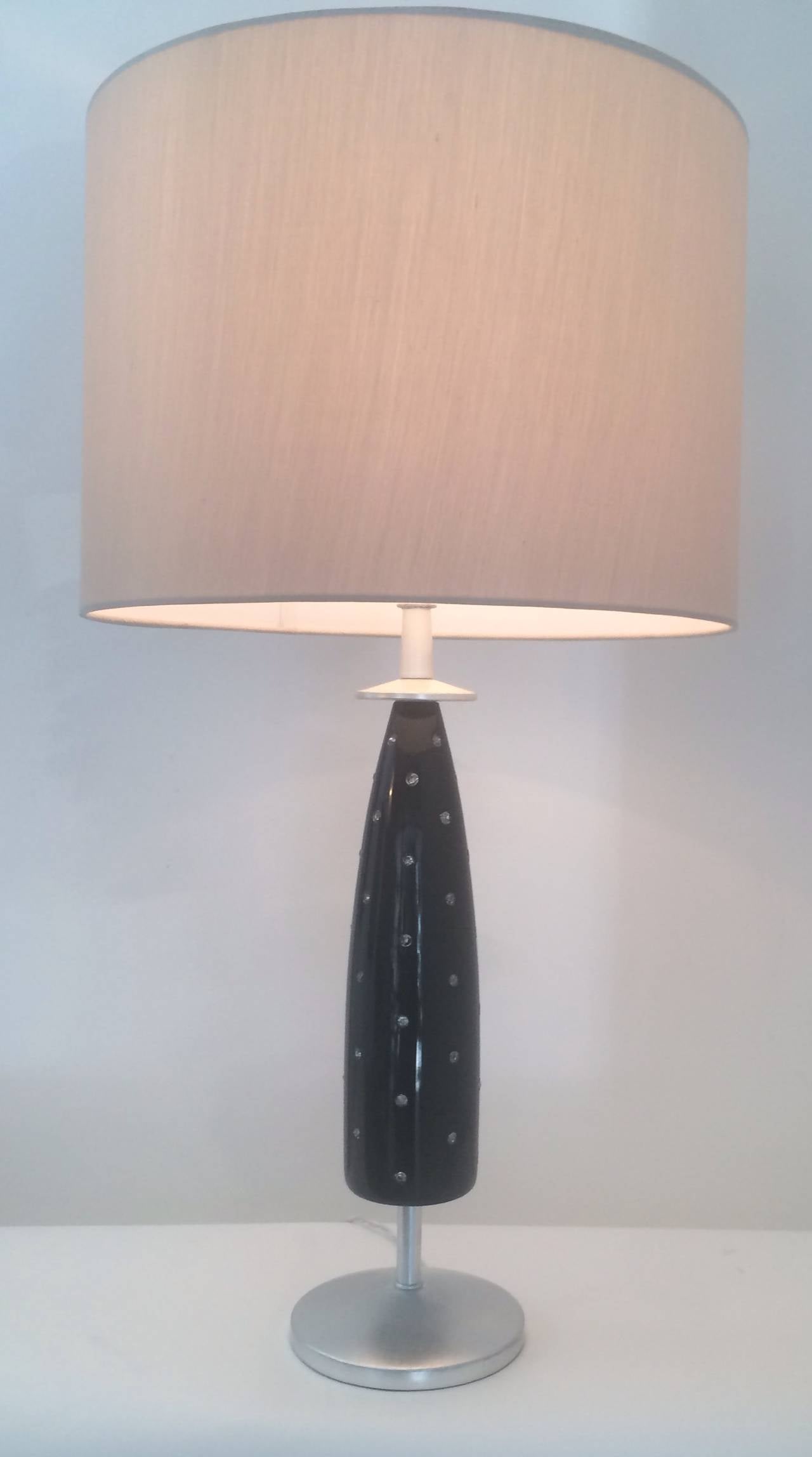 Most unique and elegant table lamp by Tommi Parzinger, 1950s.  Black lacquer base with crystals.