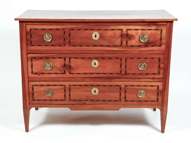 Fine Italian-made Louis XVI solid walnut commode with three dovetailed drawers and inlay. Original hardware, yellow pine as a secondary wood, dovetailed and pegged construction. Probably from Northern Italy. French polish finish.  Locks are present