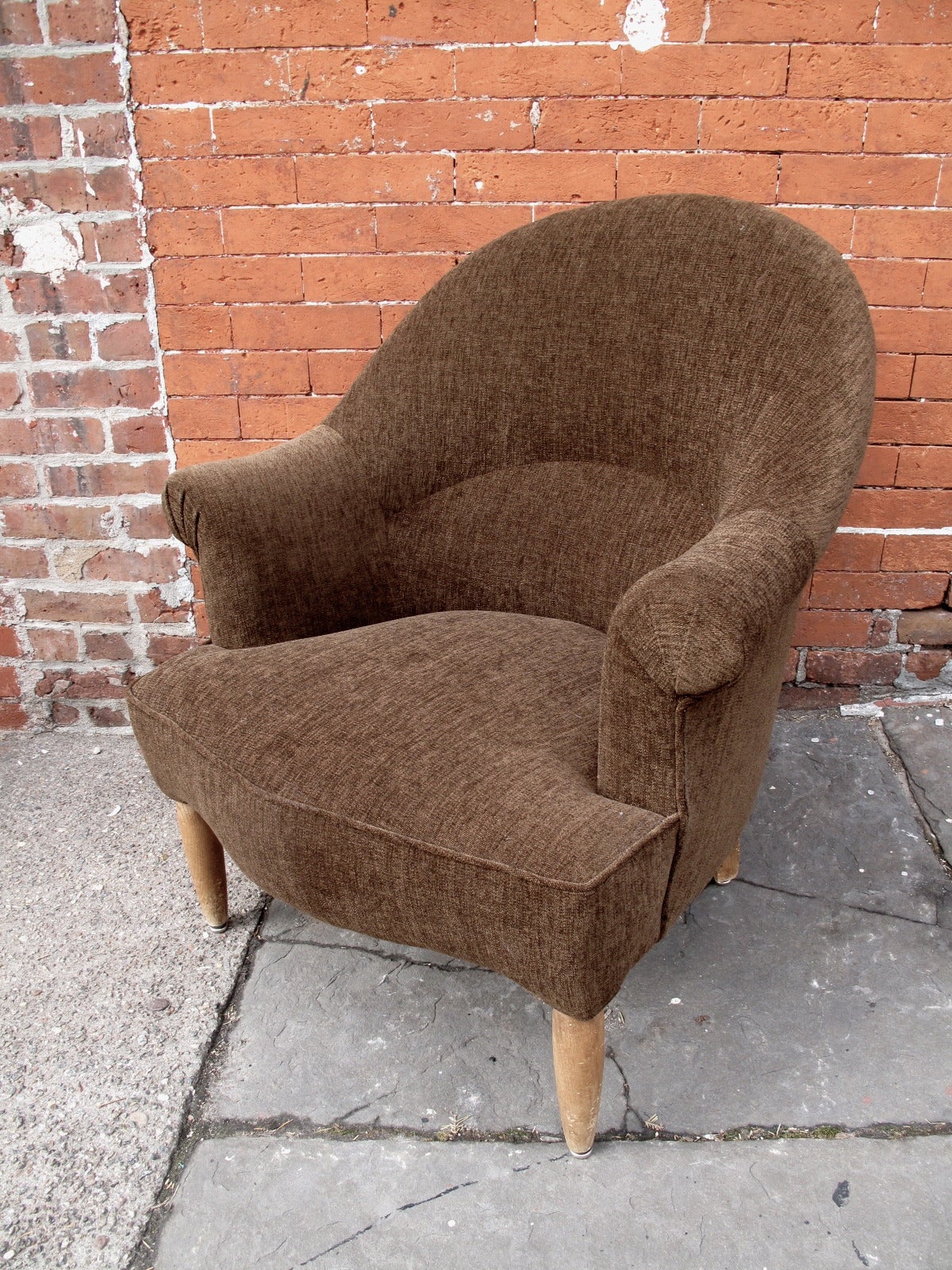 Reupholstered 1950s French chair with petite scroll arms.