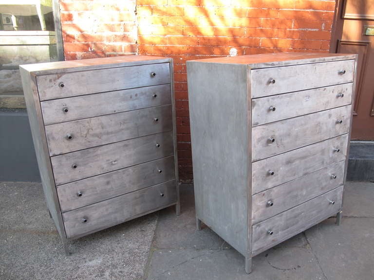 Matched pair of midcentury American dressers with replaced black knobs of the same period.  Each having six drawers.  Possibly Norman Bel Geddes for Simmons.
