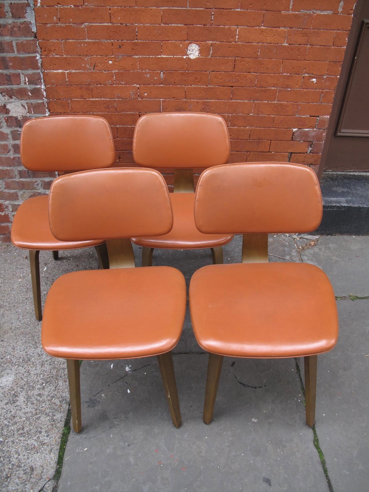 Four Thonet dining chairs in teak and original leather.
