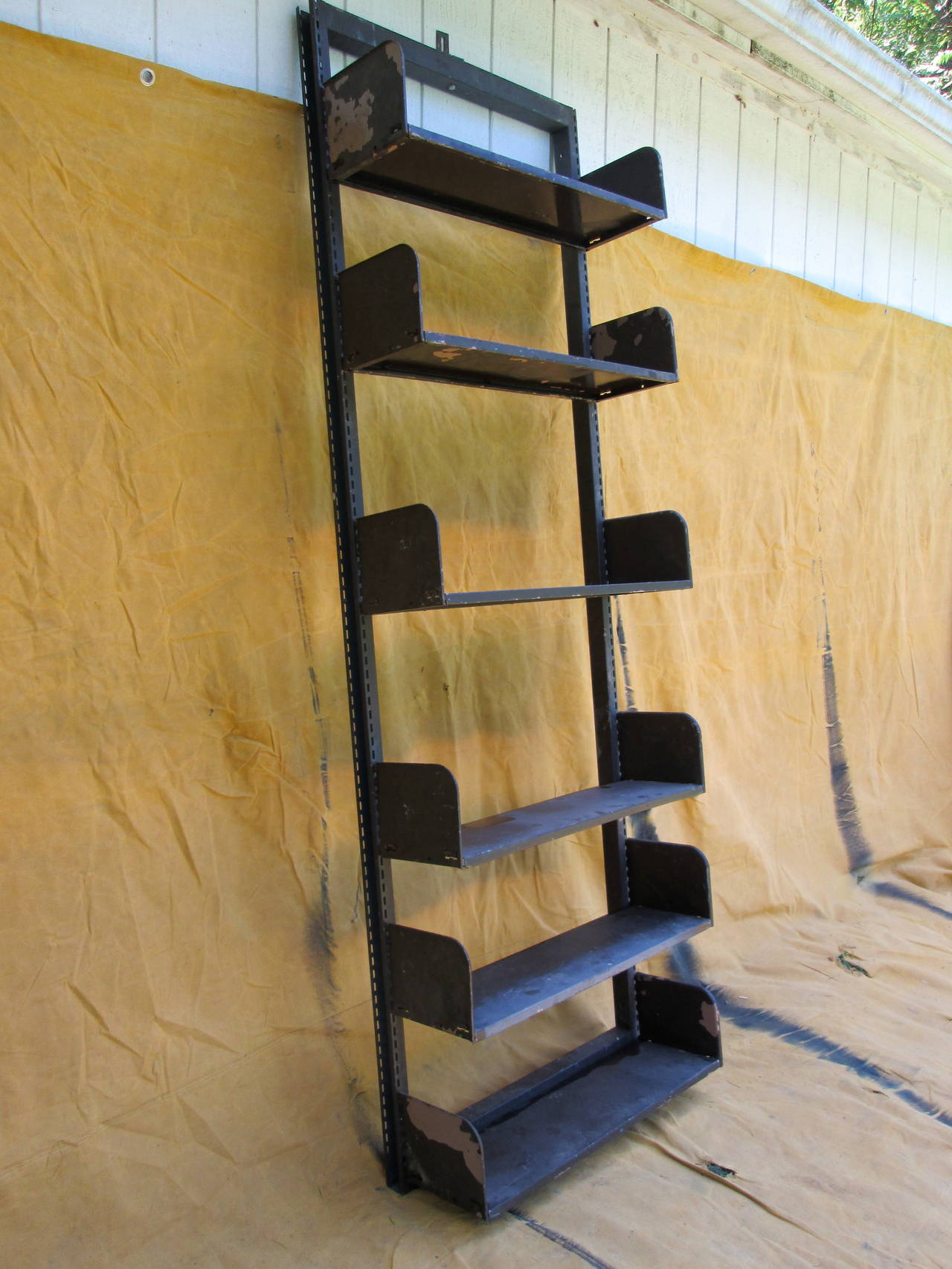 Wall-mount modular bookshelves with easy to adjust shelves. 

