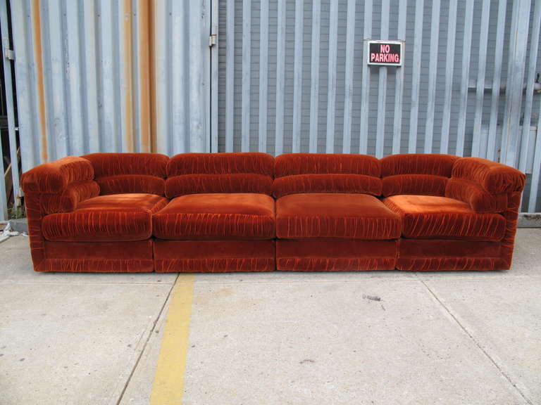 Nine piece ruched velvet sectional sofa. Four corner pieces. Four center pieces. One ottoman. Measurements for each piece are as follows:

Corners: 34