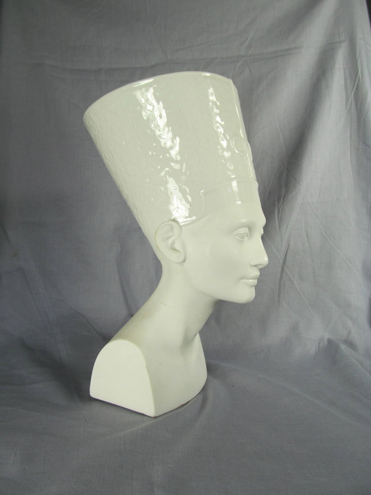 Glazed blanc de chine porcelain bust of Egyptian Queen Nefertiti. 

From the Estate of Mark Lee Kirk, Art Director at 20th Century Fox in the early to mid 1900s.