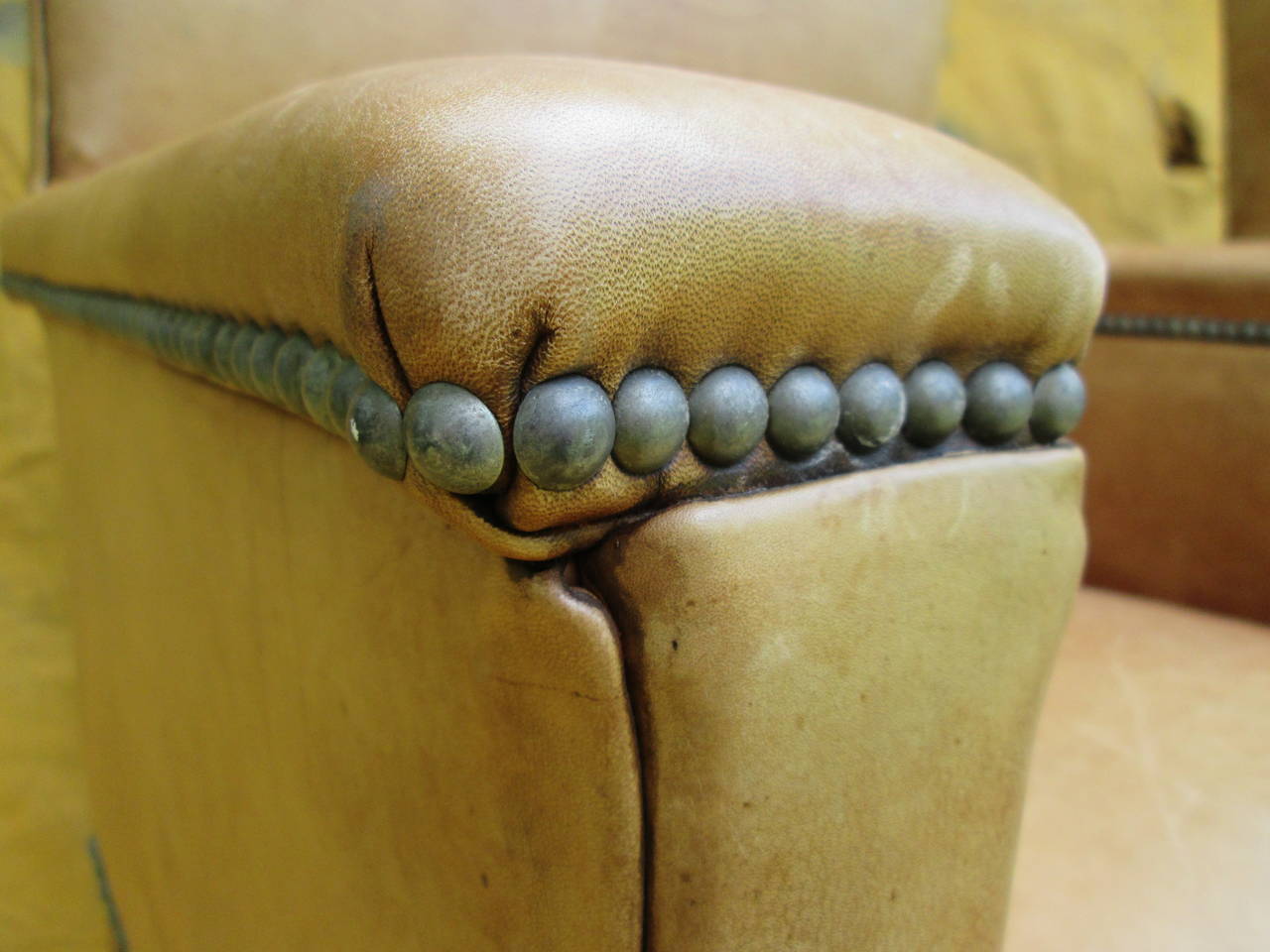 Pair of Ralph Lauren chairs in camel colored leather. Turned stretcher bases. Nailhead details. Label on underside as shown.