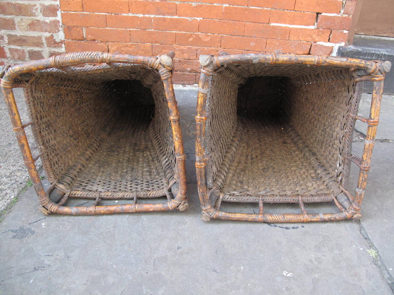 Similar pair of handwoven wicker and bamboo planters.