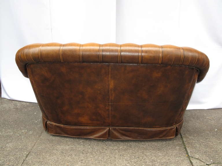 English Highback Tufted Leather Chesterfield Loveseat with Pleated Detail