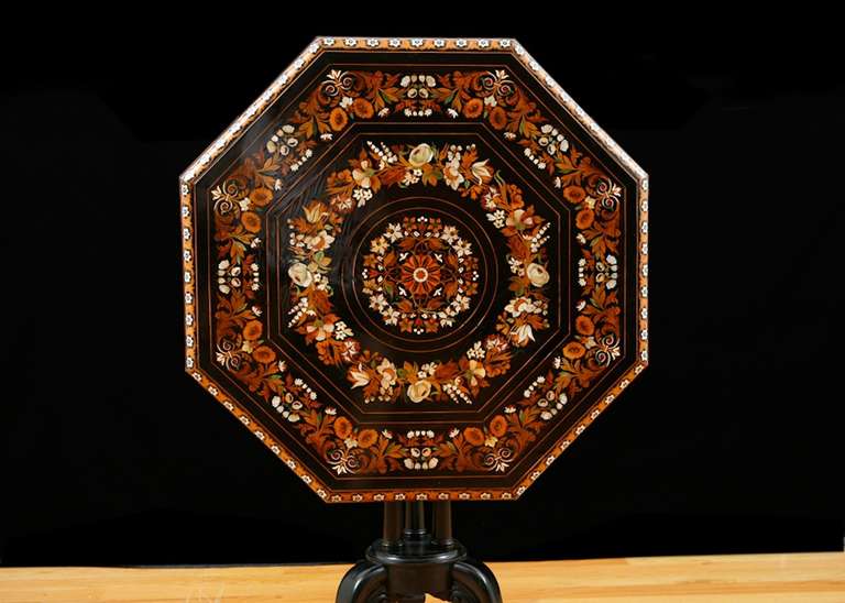 Victorian Octagonal Tilt-Top Table in Ebonized Wood with Inlays of Mother of Pearl and Various Woods, England circa 1840