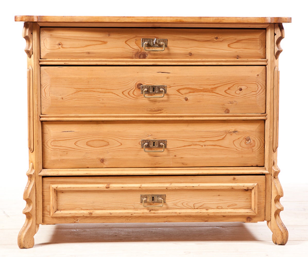 German Louis Philippe pine 4 drawer chest of drawers with working locks and pulls that also function as key plates. The German Louis Philippe period was between 1850 and 1870. It was a transitional period from the austere straight lines of