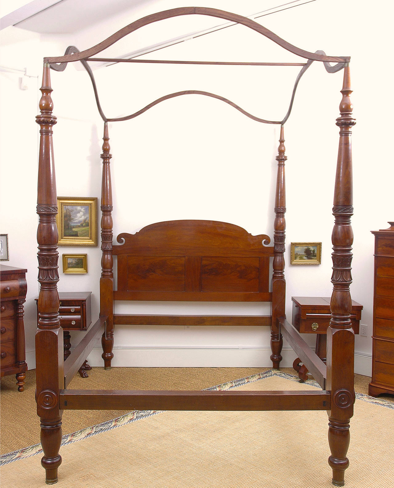 A stunning southern four-poster bed in very fine mahogany with carved tobacco & acanthus leaf embellishments on posts, and offering original tester. Probably from Virginia, circa 1810.

While the bed was originally wide enough, the side rails were