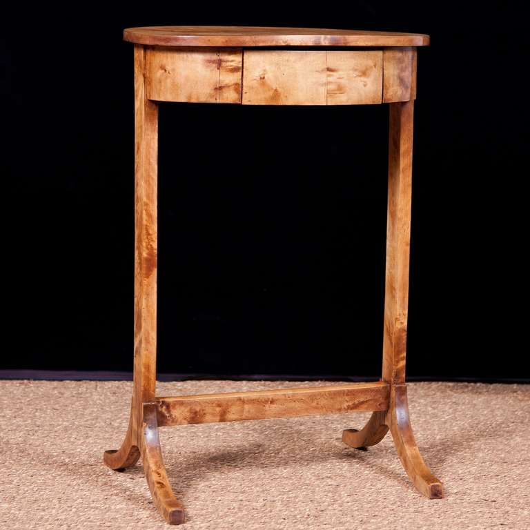 Gustavian Swedish Side Table in Birch, c. late 1700's

20” wide x 13” deep x 29.25” high
A lovely table with fine proportions featuring an oval top with one drawer and a trestle base.