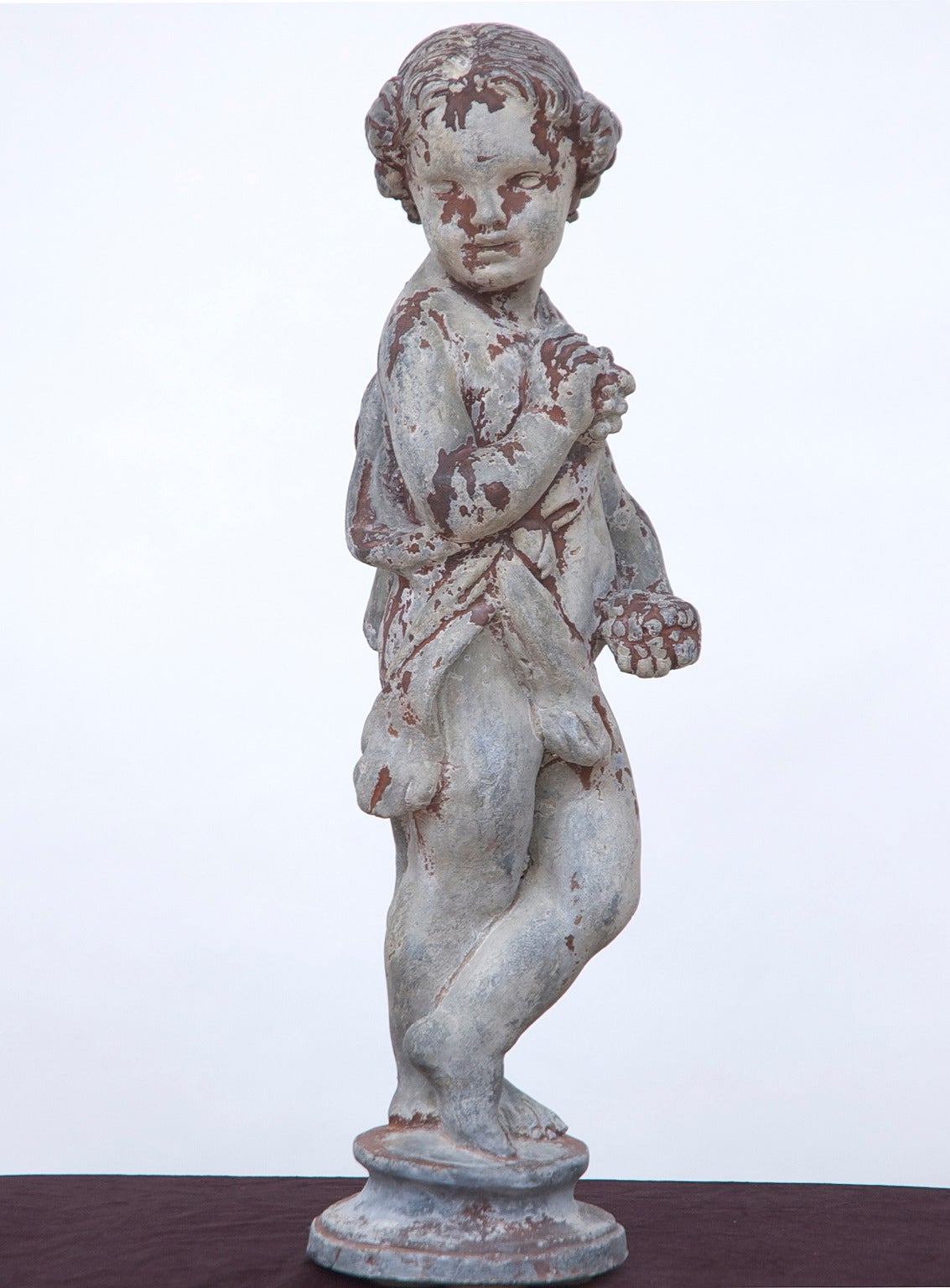 English Cast Lead Garden Statue of Child Holding Grapes Representing 