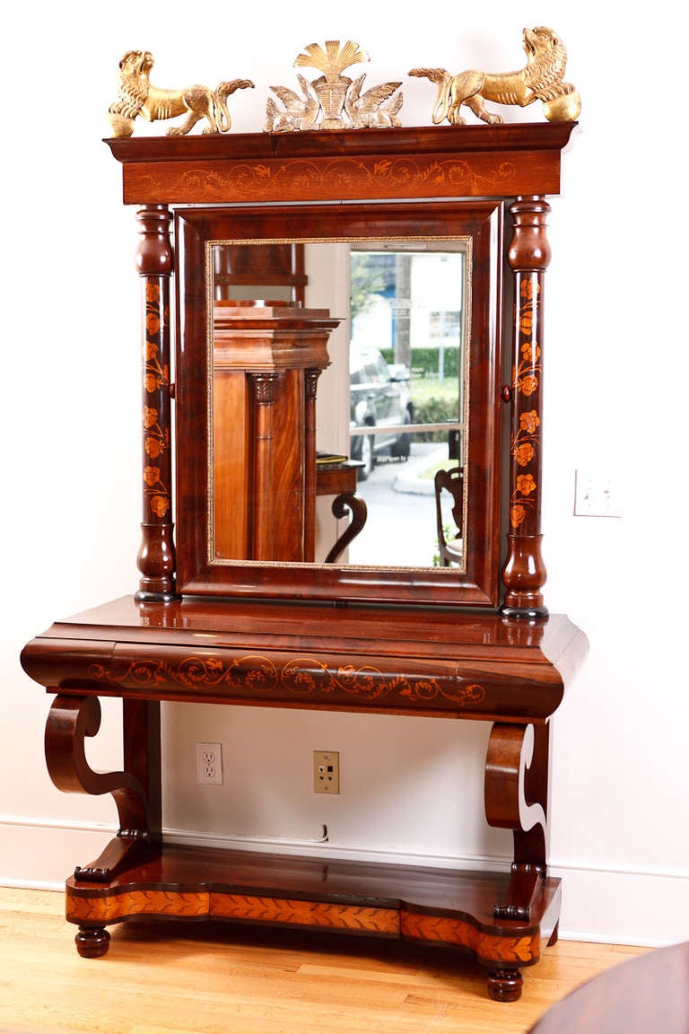 Fine Spanish Empire console with original mirror in mahogany and rosewood with satinwood inlays, circa 1810. One of the most unusual and beautiful mirrored consoles that we have ever had. First class.

Measures: 51