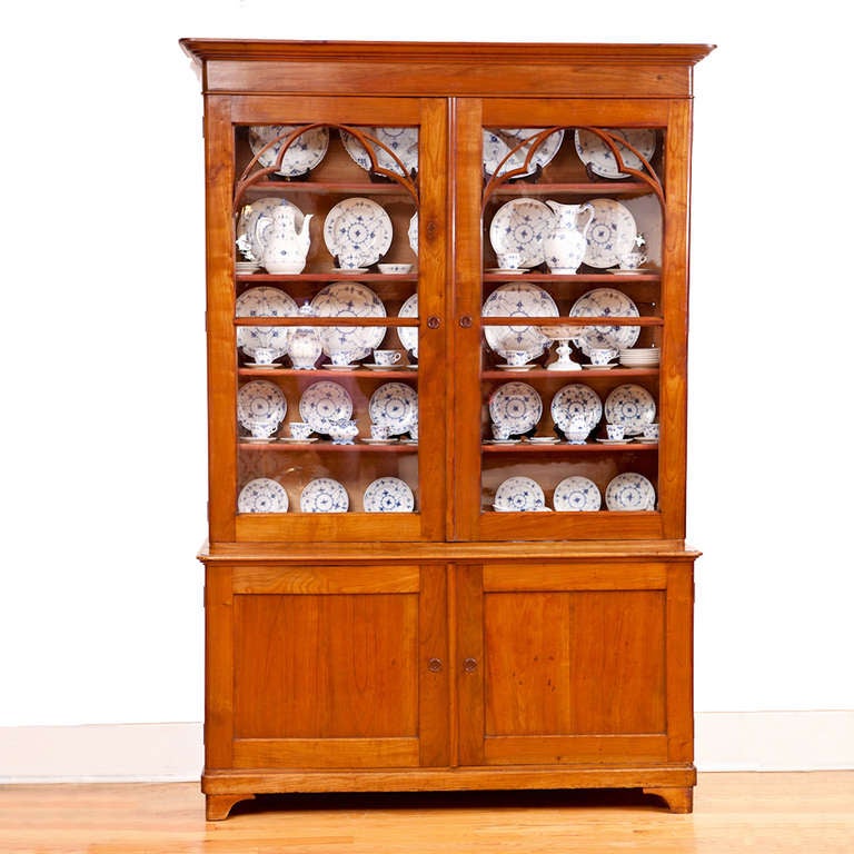 A very beautiful French Charles X bookcase in cherry, circa 1820 with original glass panels and key. Original French polish finish. Makes a great bookcase or display cabinet!

Measures: 58