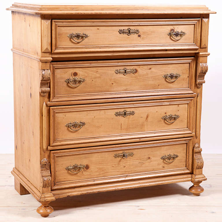 German Gründerzeit 4 drawer chest of drawers with applied snails and original feet. Features brass pulls and brass key plates and 1 key. Locks are working. Drawers slide in and out easily.

Measure: 39 1/2