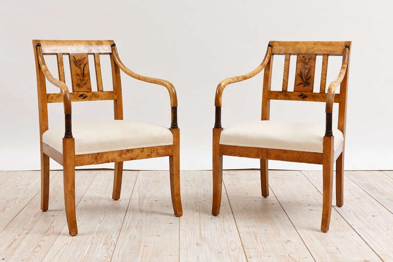 Previously listed at $9950

Swedish Biedermeier Style Suite in Birch with Ebonized Details, c. 1925. Suite contains Salon Table, Four Salon Chairs and Two Armchairs. Dimensions: Armchairs (24