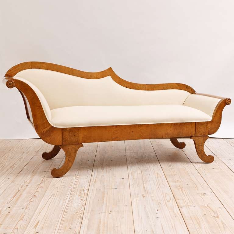 Swedish Biedermeier Divan or Meridienne in Birch,  c. 1820.  Exquisite form and proportions, upholstered seat and back in muslin. While it presently has an unfinished back, should the application call for floating the divan, we could replace the