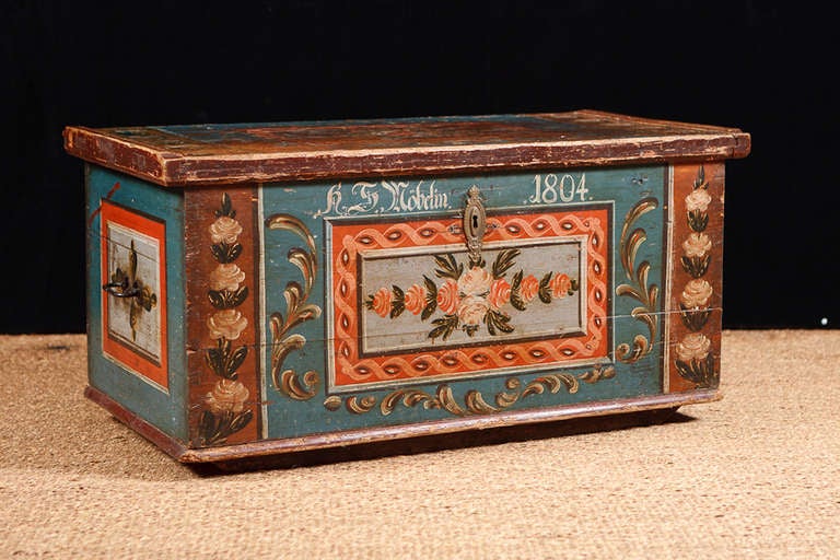 This beautiful bridal chest with original paint from Austria is dated 1805. Works well as a blanket chest, coffee table or at the foot of a bed. The painting is all original and in excellent condition on the front and sides. It is a bit more worn on