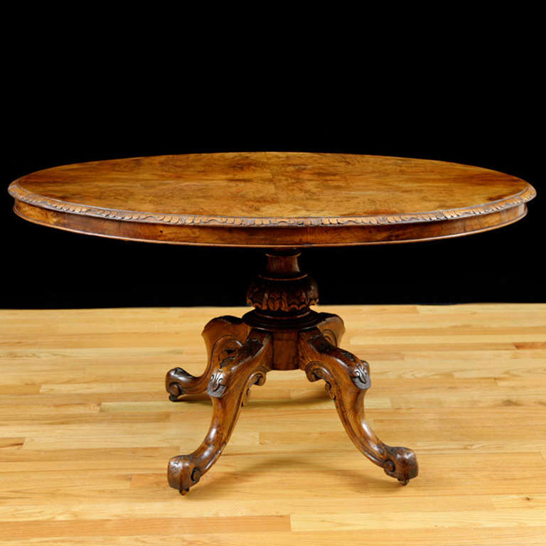 Beautiful burl walnut oval tilt-top pedestal table.
Perfect for a center hall, small dining table or as a side table for a lamp.

Measures: 53