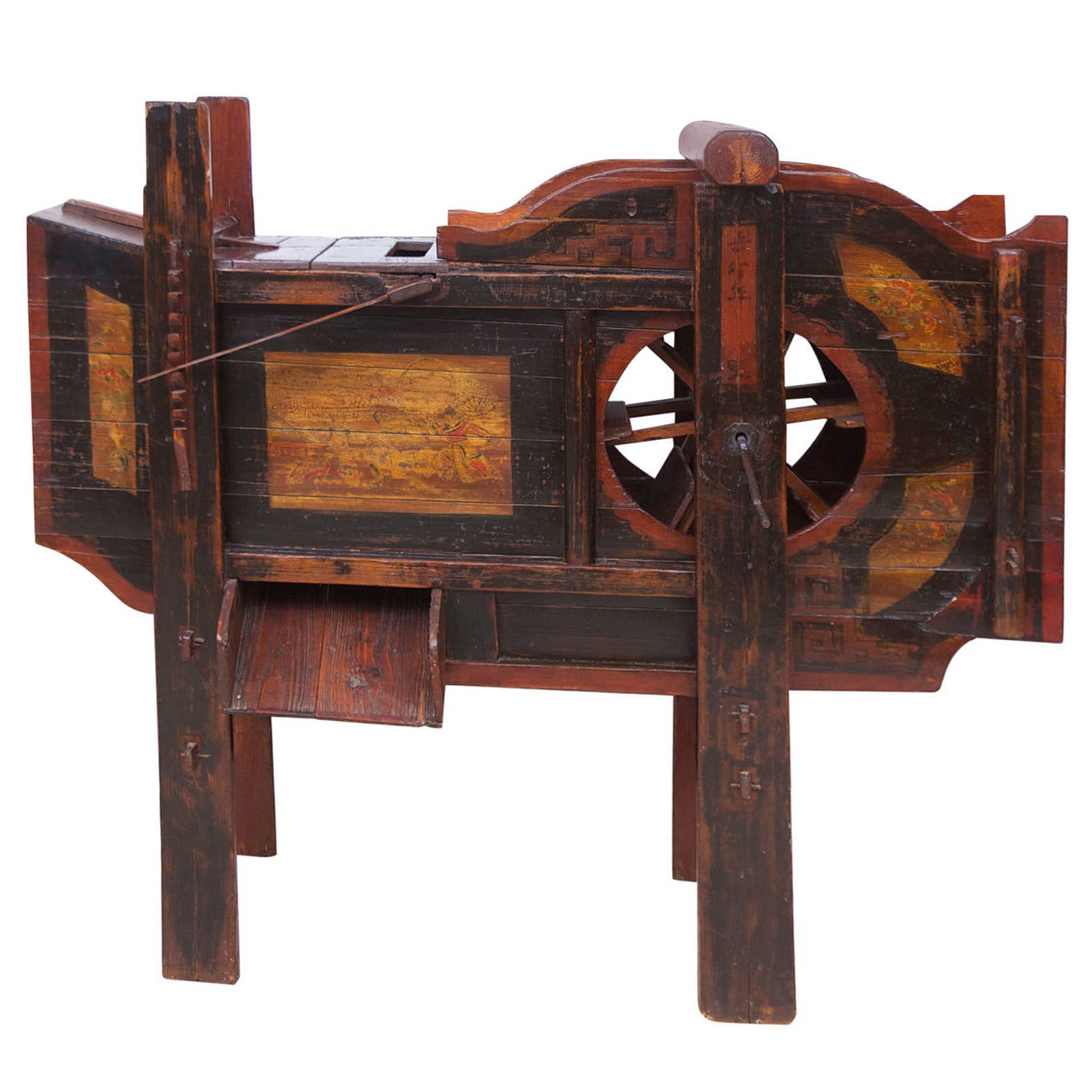 A rare and beautiful Chinese wind-winnowing machine for separating grain from chaff. This particular machine was used for rice. Made of wood with painted decorations in black, ochre and red, which include floral motif and scenes of Chinese life,