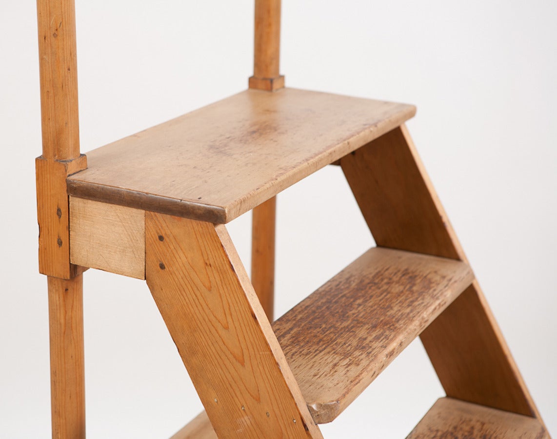 This American scrubbed pine library ladder would be a perfect way to retrieve books from your home library or a perfect perch for your potted plants. Reminiscent in design of the Hancock village shakers of Massachusetts.

Measures: 23