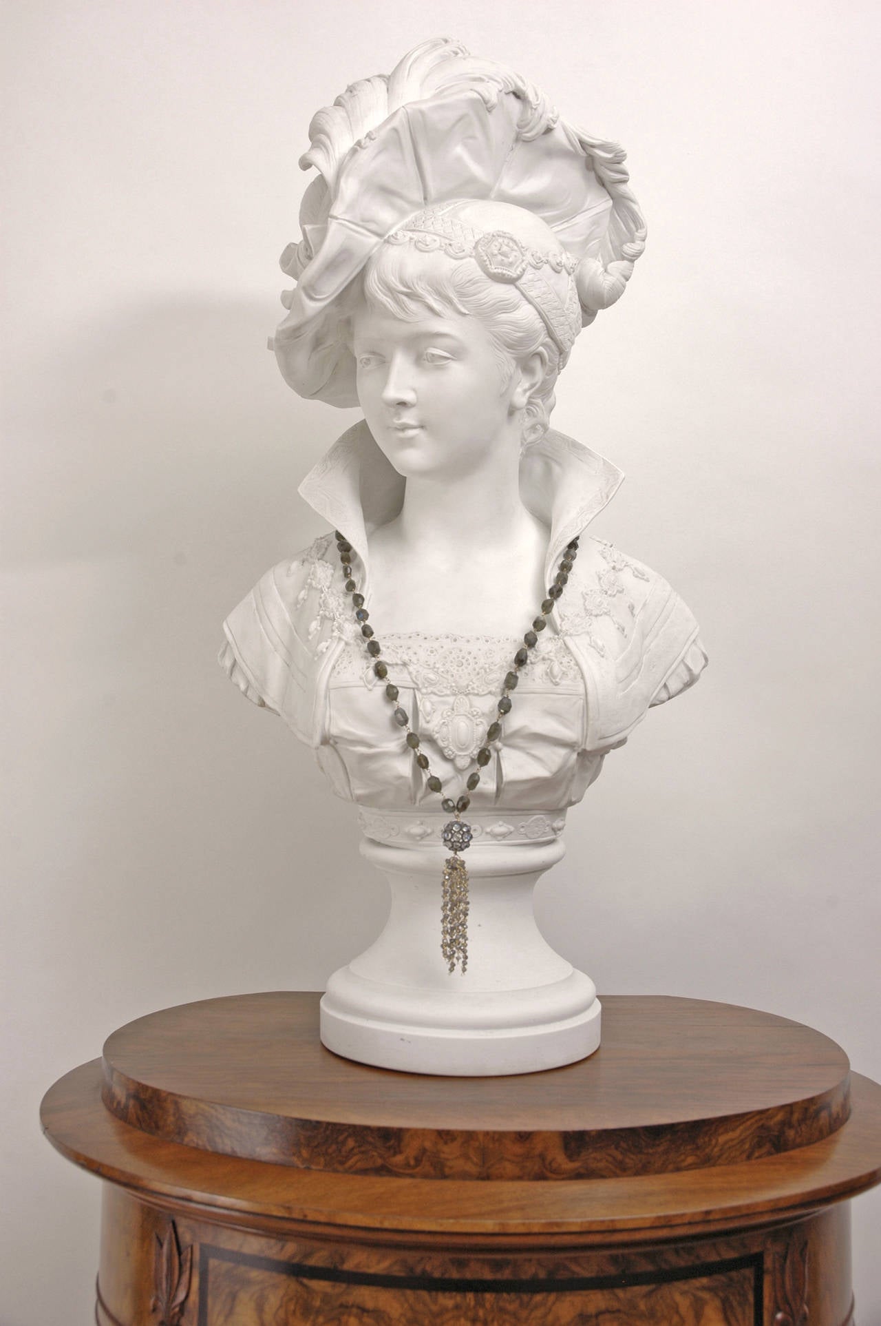 French Bust of a Young Woman with Plumed Hat by Paul Duboy