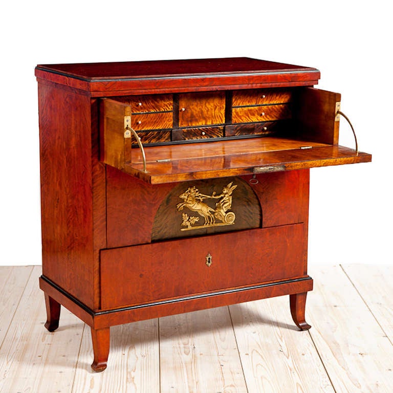 Karl Johan chest of drawers and secretaire, Sweden, circa 1820.
Offers a rare and lovely writing desk with the first of three drawers opening to a writing desk containing small drawers and cabinet compartment finished in faux tortoise. French