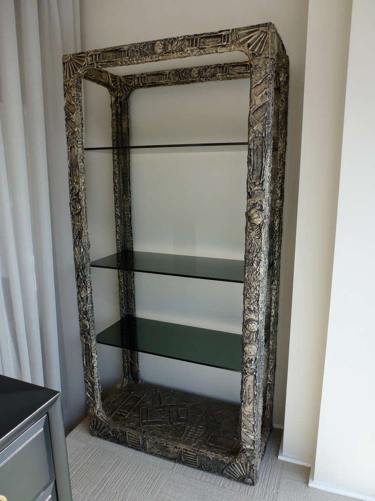 Brutalist Style etagere designed by Adrian Pearsall for Craft Associates. In the manner of Paul Evans. Antique bronze resin finish with smoked glass shelves.  Strikingly sculptural piece.  Finish is in excellent condition!