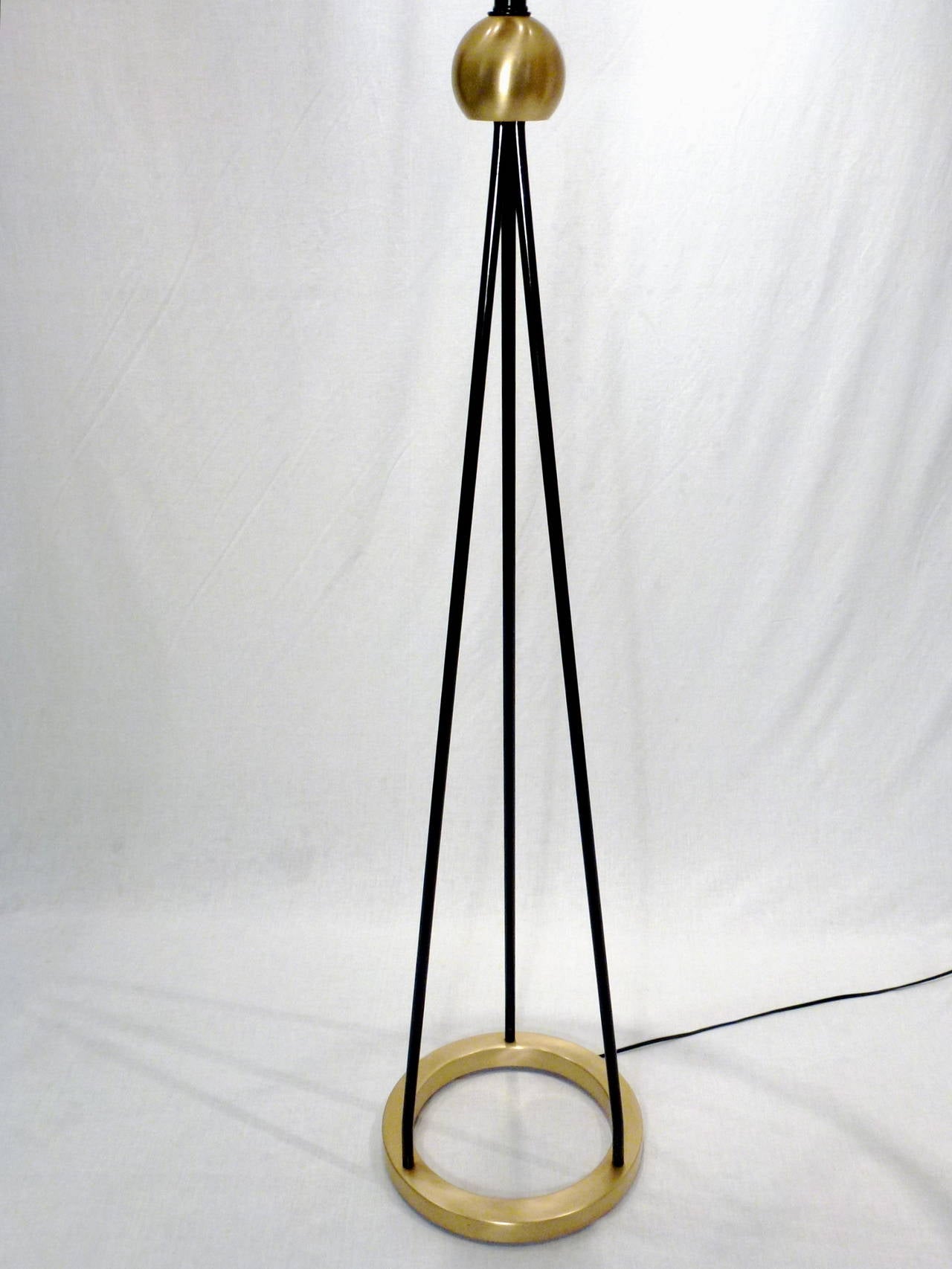 Mid Century Modern Classic Floor Lamps Designed by Walter Von Nessen.  Brushed Brass Circular Base and Sphere Joinery Detailing with Black Metal Tripod Base.  Shade Included.  

2 Available.  Second Lamp is 55