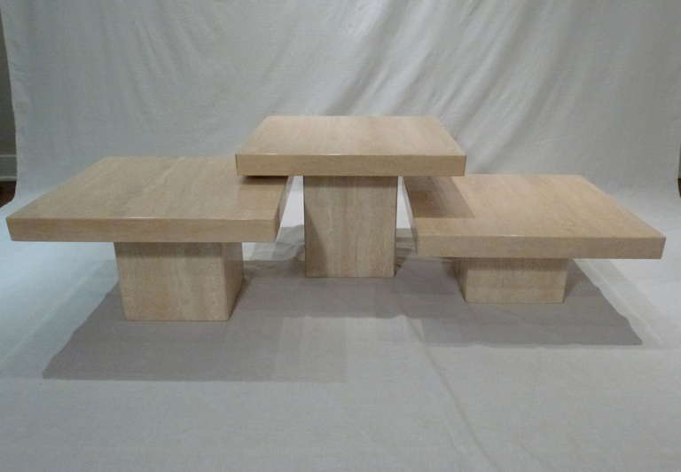 A Magnificent Set of 3 Custom Solid Travertine Coffee Tables from Italy. The Polished Stone Tables have Cubed Bases and Square Tops.  Varying Heights Allow Tables to be Layered and Configured as Desired. Wonderfully Versatile!   Table Heights are 