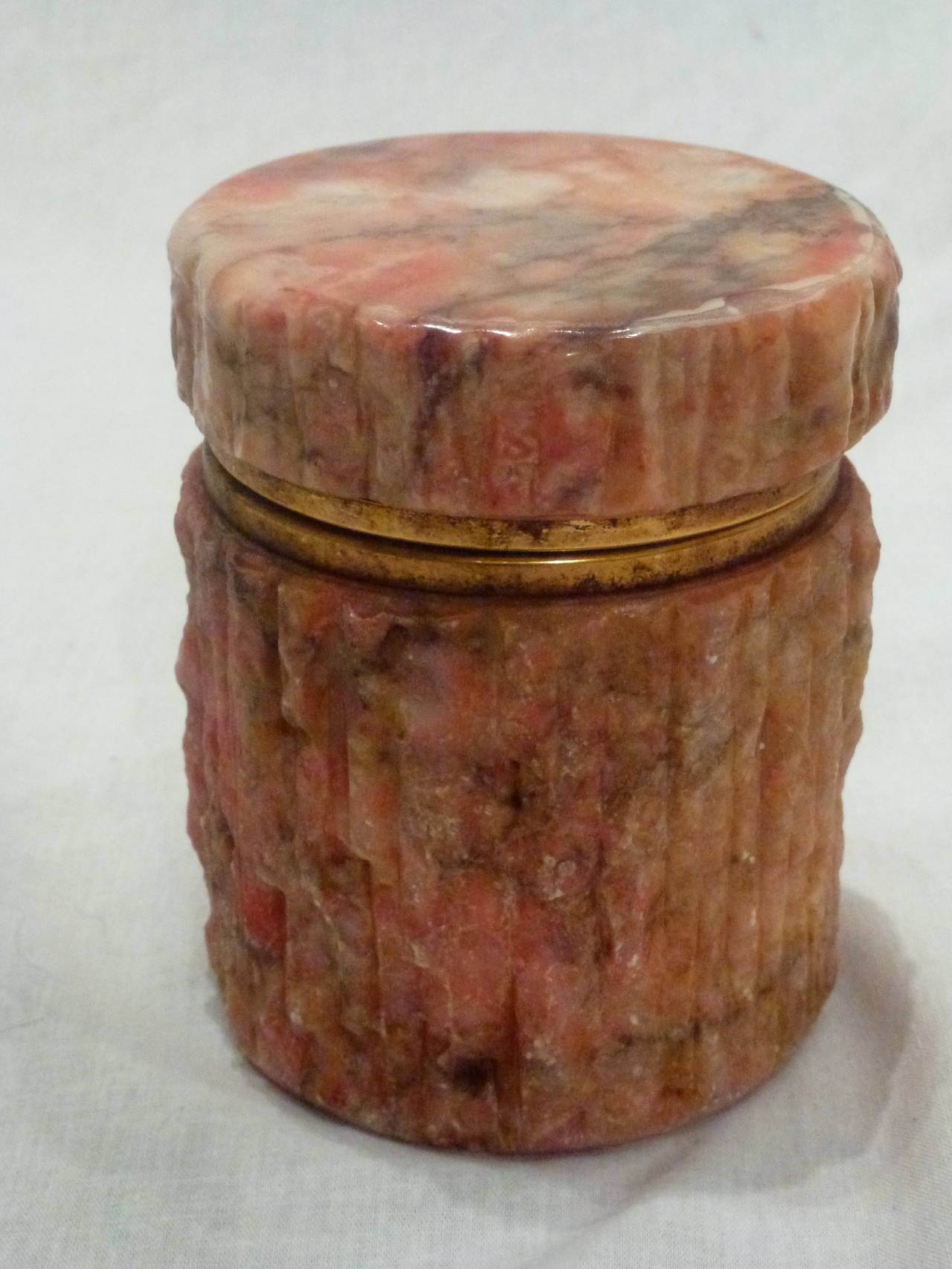 Striking Vintage Set of Coral Colored Marble Vessels from Italy.  The Cylindrical Box has a Hinged Lid with Bras Detailing and a Chiseled Finish to the Sides and a Polished Top. The Low Urn Shaped Bowl has a Polished Finish with a Rounded Rim at the