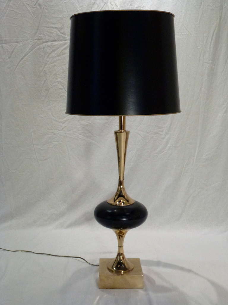 Pair of Monumental Polished Brass and Black Genie Bottle Table Lamps by Rembrandt.  Sleek, Minimalist Detailing. Black Drum Shades Piped in Gold rest atop original Milk Glass Diffusers.