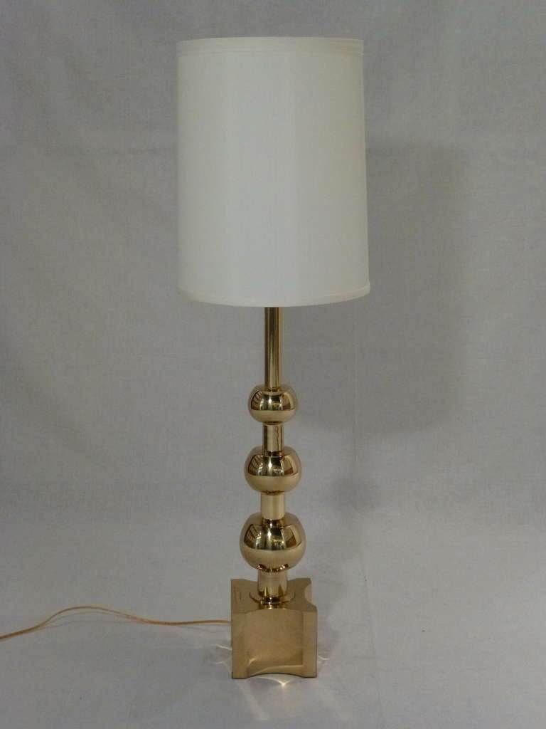 Pair of Monumental Brass Stacked Sphere Table Lamps by Stiffel with original Stiffel Label.  Wonderful Scale.  Excellent Restored Condition. Would Make a Dramatic Statement in any Room.  The Brass has Great Polished Patina. Shades included.  
1950's