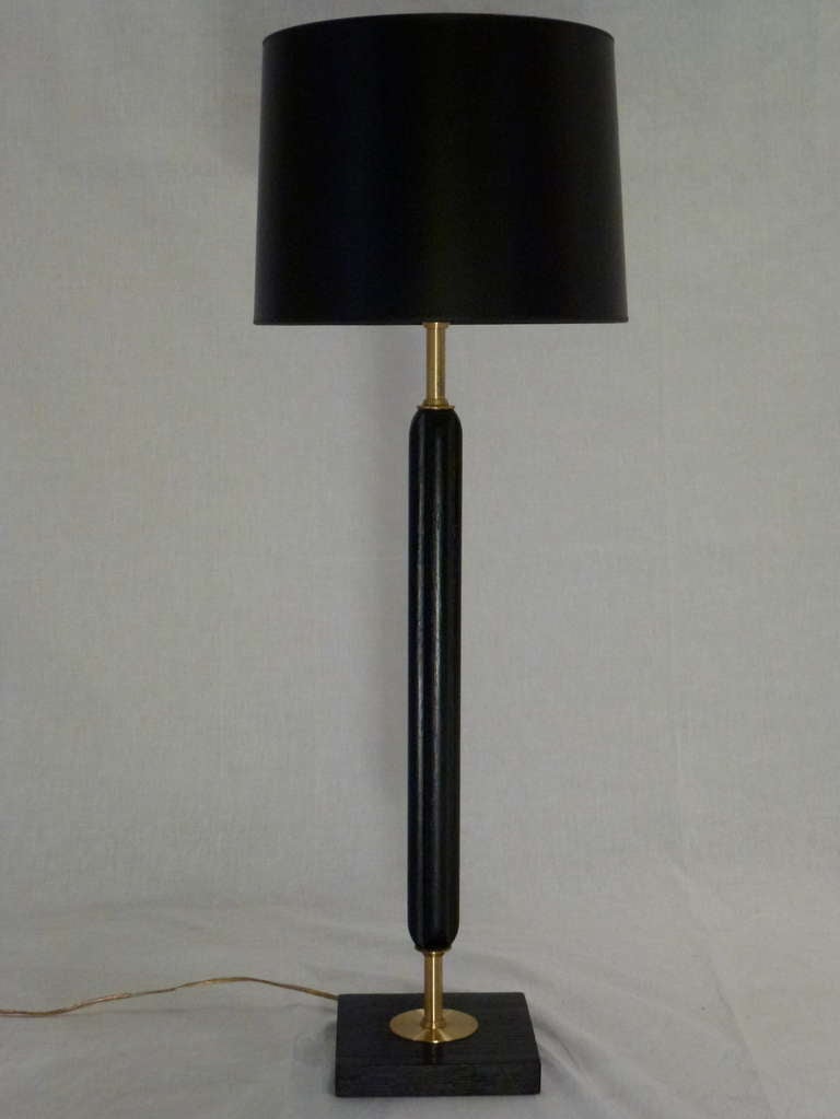Stunning Pair of Streamline Art Moderne Candlestick Lamps.  The Fluted Stem and Base are Ebonized Oak with Polished Brass Detailing.  Shades Included.
1940s