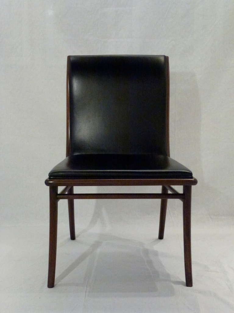Pair of classic Greek inspired sabre leg chairs designed by T. H. Robsjohn-Gibbings for Widdicomb.  Upholstered in original black leather.  1950's.