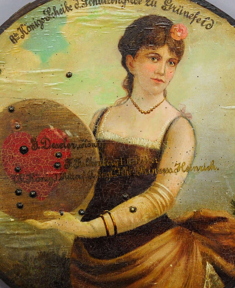 a rare antique shooting target. oil on canvas on a wooden plate. on top inscription of the rifle club gruenefeld near berlin. the target depicts a victorian lady holding a wooden target. impacts of the shooting which has taken place may the 22 in