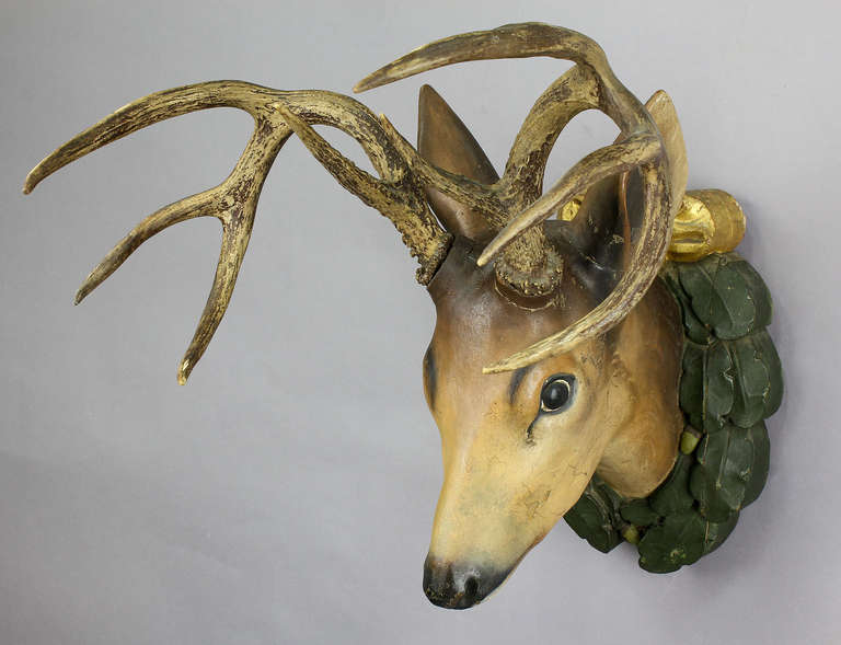 handcarved wood deer head with original sika antlers. mounted on a wonderful carved wood plaque. executed ca. 1920.