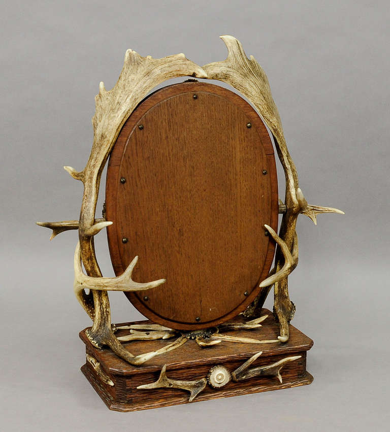 Antique Carved Wood Vanity Mirror with Antler Decorations 1