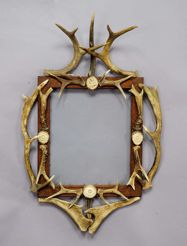 Black Forest Carved Frame with Antler Decoration
