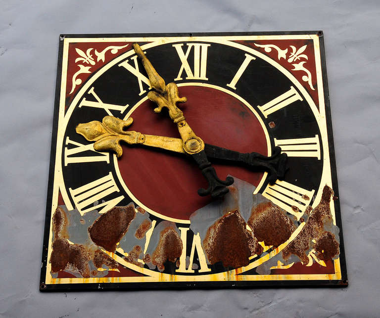 a large antique metal clock face coming from a german church. numerals and hands with gild paint. beautifully weathered patina, original hands.