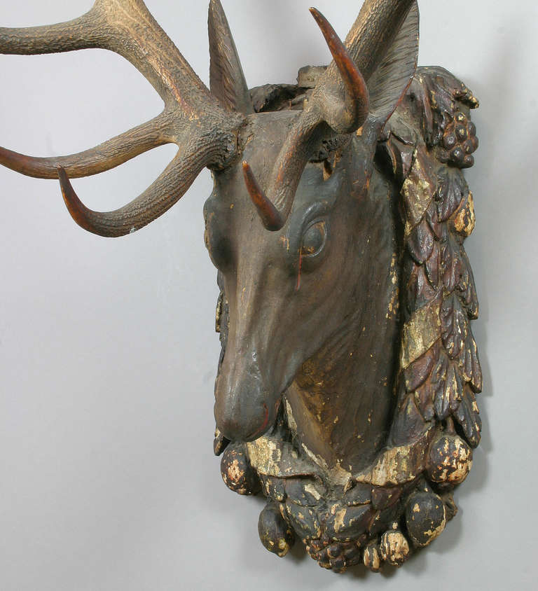 carved wooden stag head